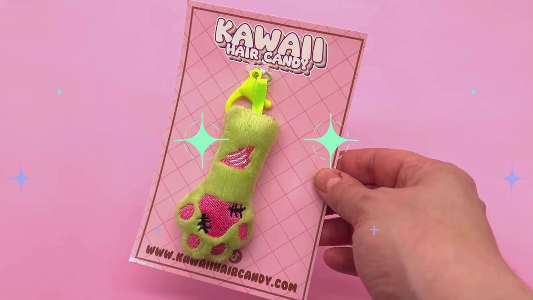 video of cat paw plushie keyring