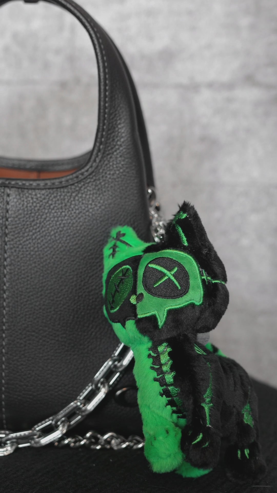 video of a Frankenstein themed cat keychain 