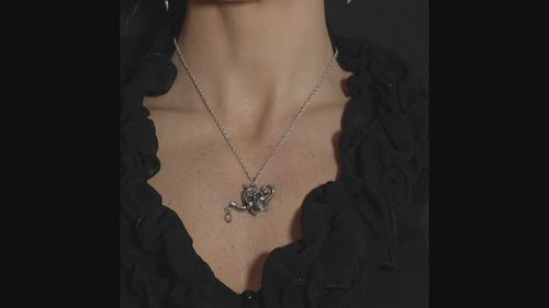 victorian goth woman wearing a gothic teapot skull necklace