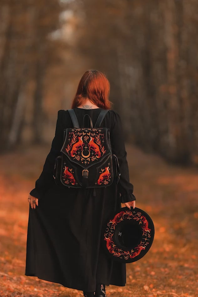 video of a woman wearing a fox backpack