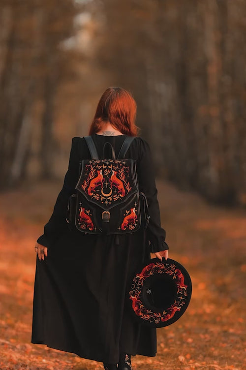 video of a woman wearing a fox backpack
