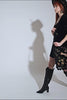video of gothic witch wearing a large boho goth bag