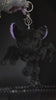 video of a purple and black skeleton bat keychain