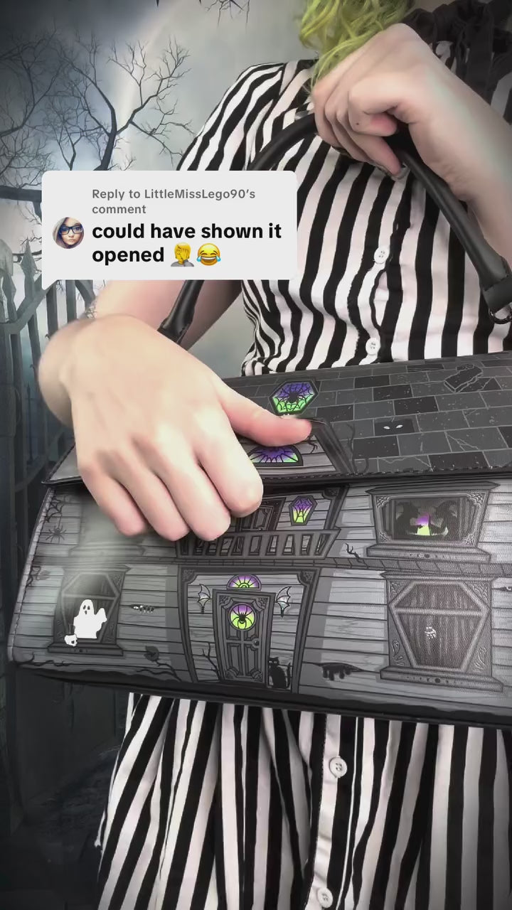 video of a gothic girl wearing a halloween novelty handbag 
