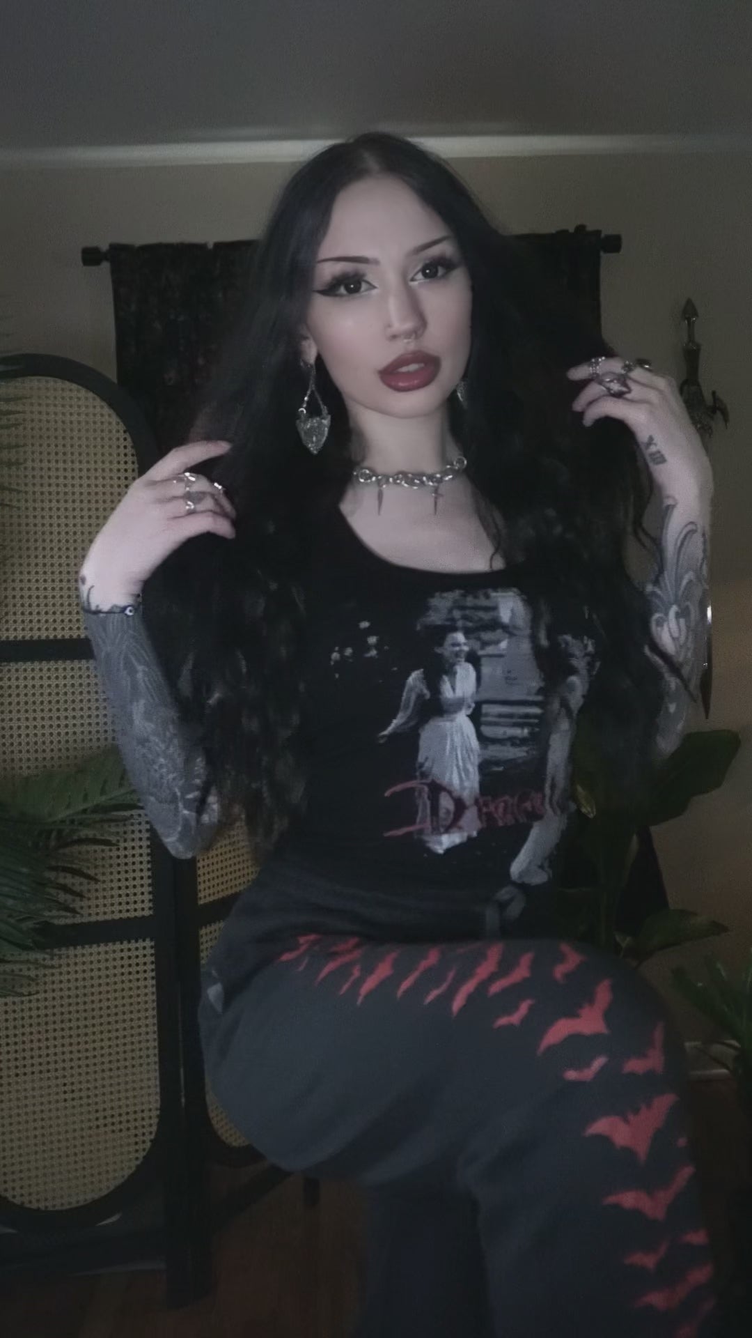 video of a gothic woman wearing bat sweatpants