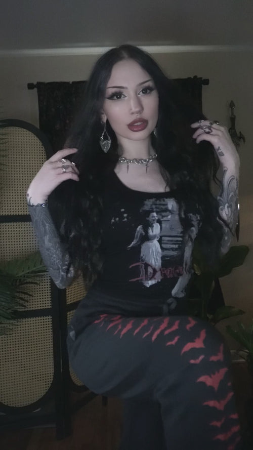 video of a gothic woman wearing bat sweatpants