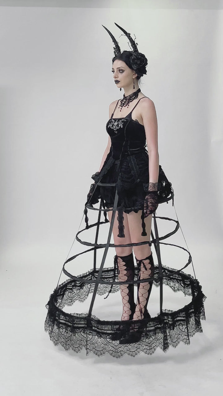video of gothic girl wearing a maxi length black caged hoop skirt