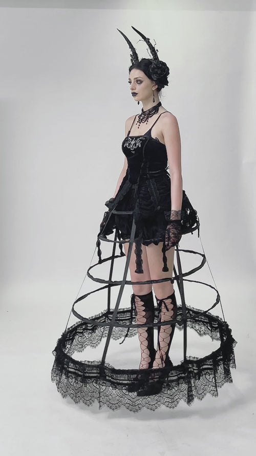 video of gothic girl wearing a maxi length black caged hoop skirt