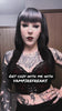 goth woman wearing skull raven jogger pants in a video clip
