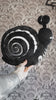 video of a skeleton snail plushie