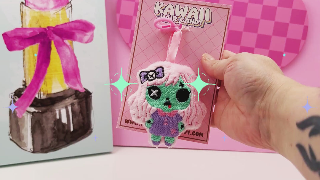 video of a voodoo creepy cute doll plush 3d keychain