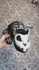 video of a gothic skeleton rat plushie