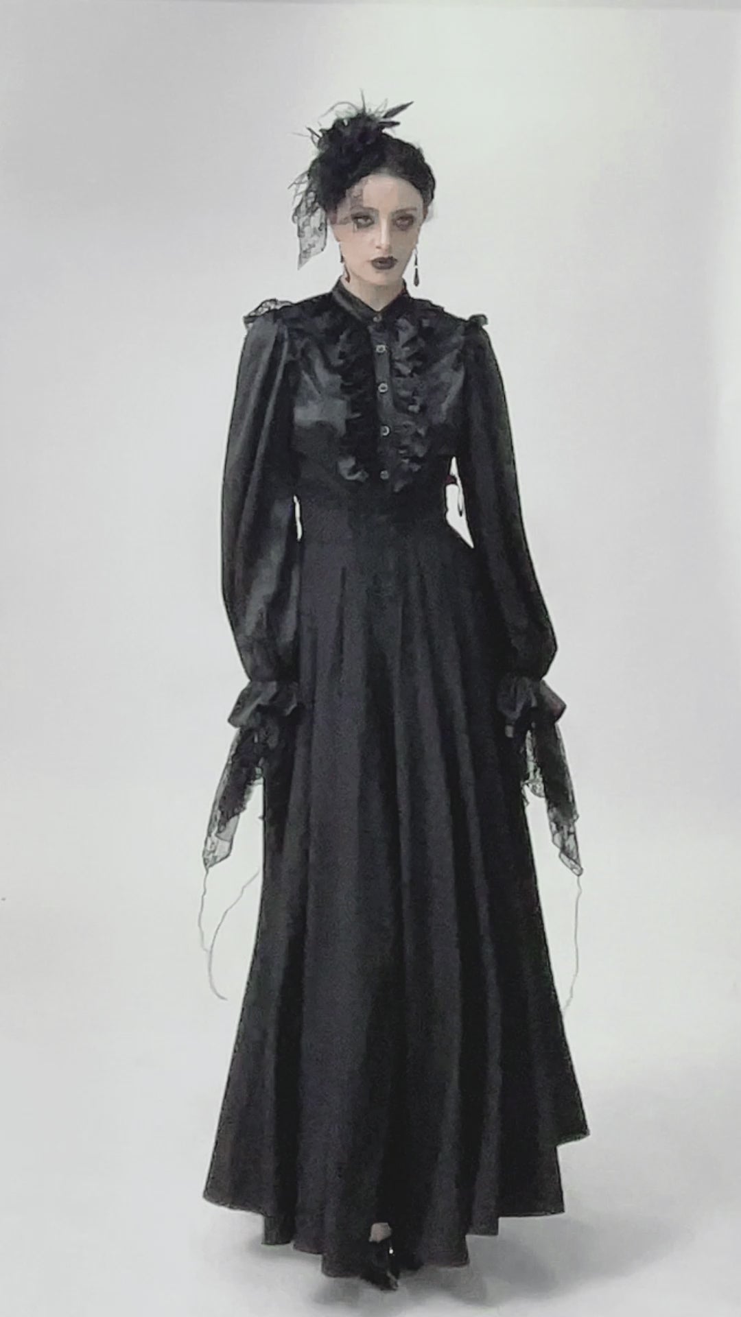 Video of model wearing goth fashion long black skirt