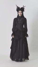 video of a gothic woman wearing a high low hem gothic coat