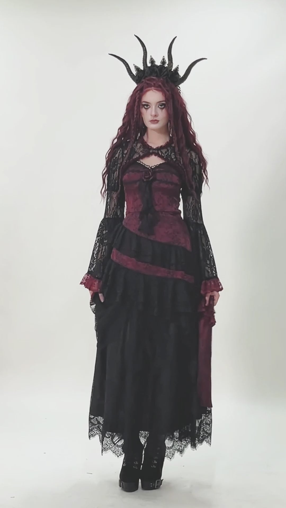 gothic women wearing elegant vampire clothing 