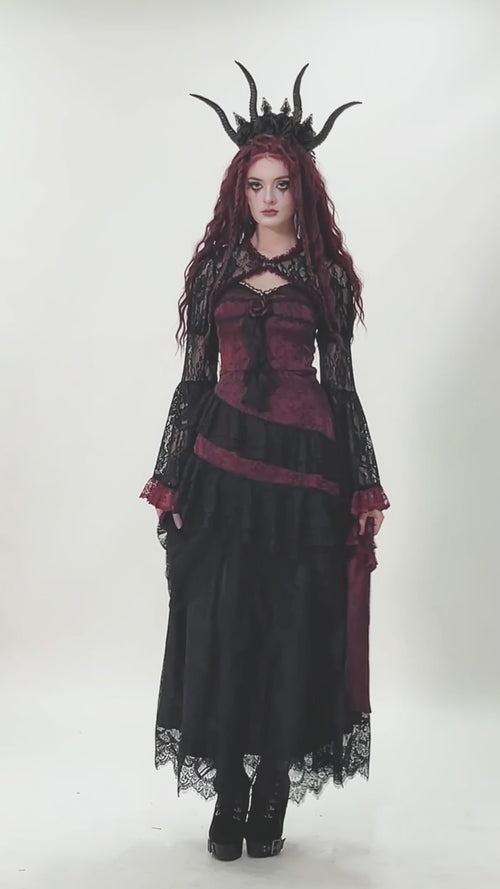 gothic women wearing elegant vampire clothing 