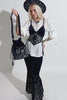video of a gothic woman wearing a dark blue velvet embroidered moon and moth shoulder bag