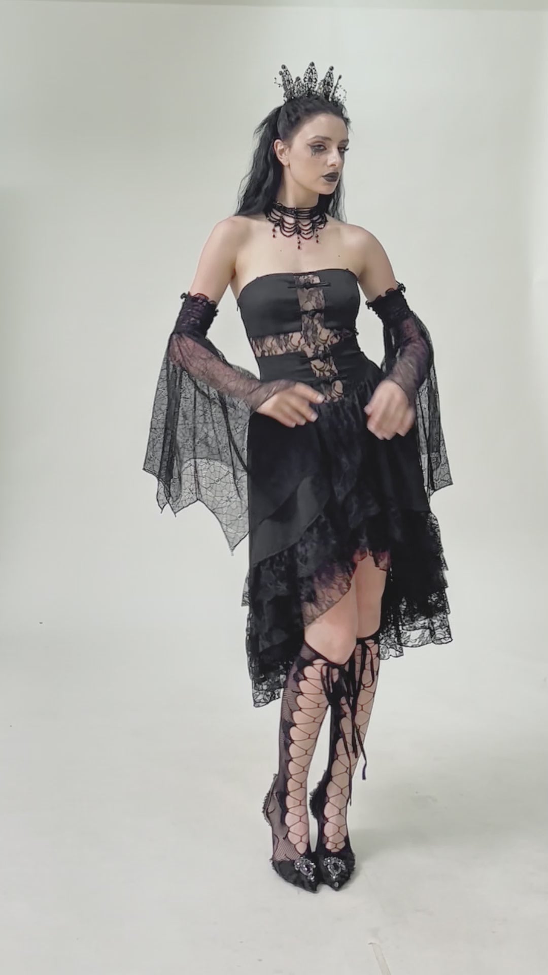 video of gothic woman wearing spiderweb sleeves