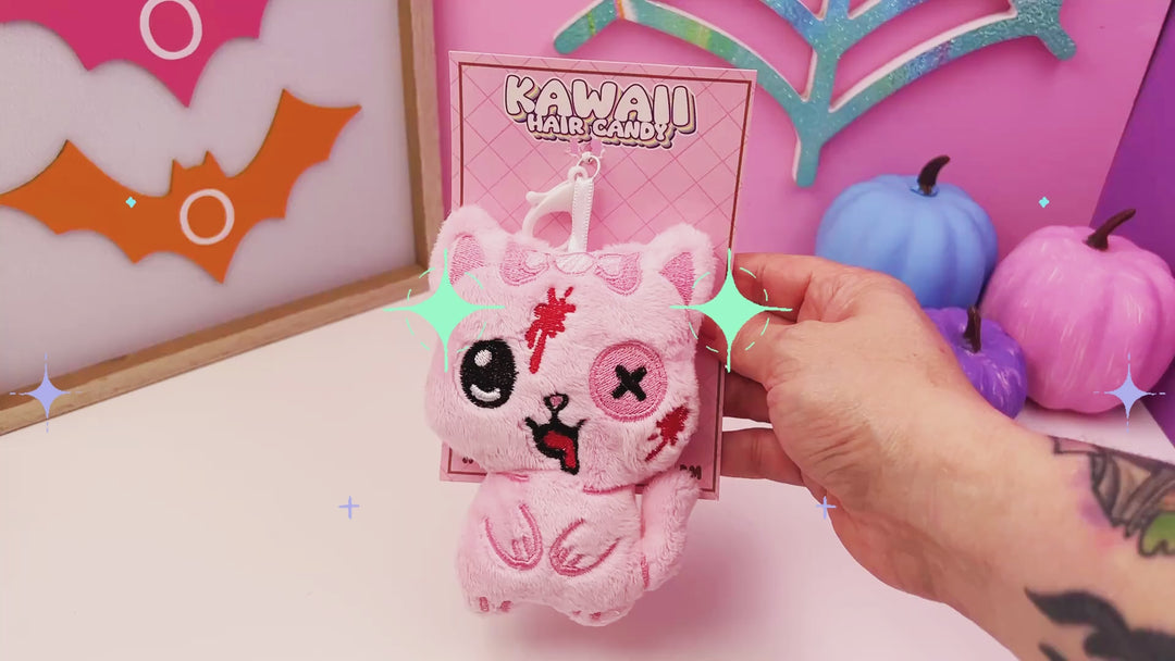 video of a spooky sweet pastel goth plush kitten cat keychain