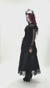 video of a victorian goth woman wearing a ruffled long sleeve top