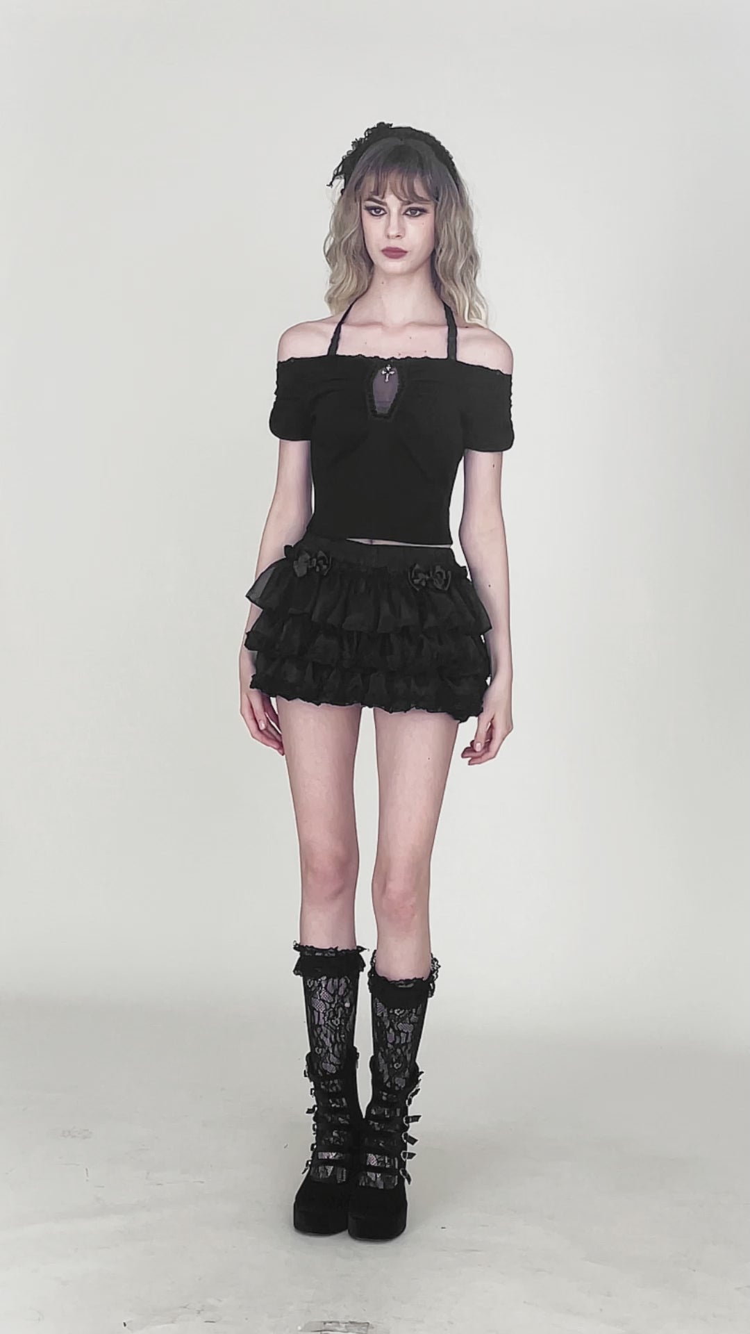 Video of model wearing black ruffle bloomers with bows