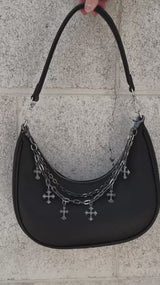 video of a gothic black handbag with a chain strap with charms 