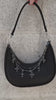 video of a gothic black handbag with a chain strap with charms 