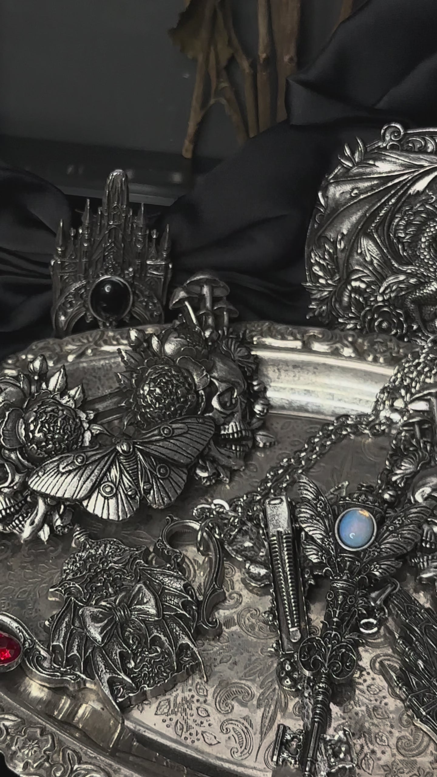 video of dark cottagecore necklace and other pieces of dark jewelry 