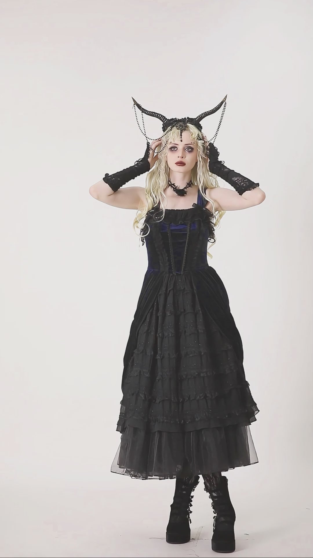 gothic girl wearing black and blue lolita dress