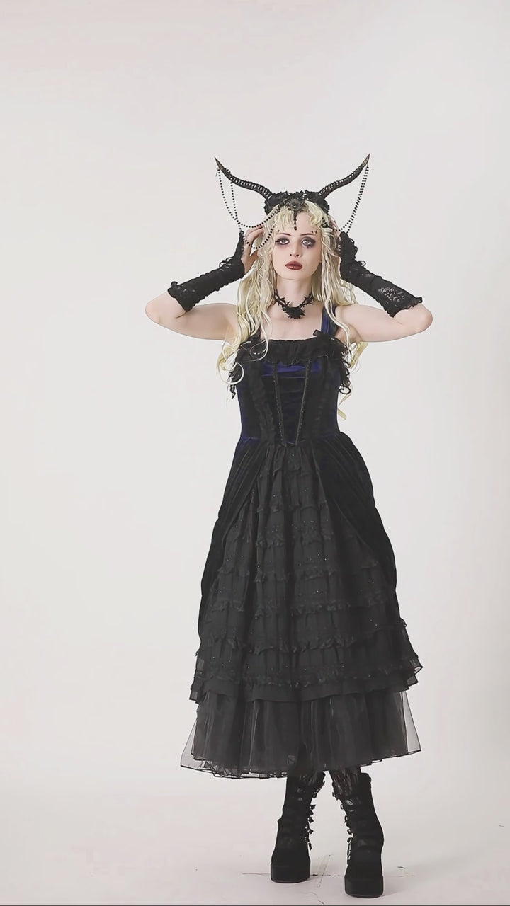 gothic girl wearing black and blue lolita dress