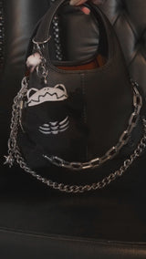 video of a small skeleton frog keychain