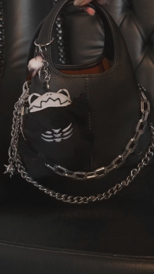video of a small skeleton frog keychain