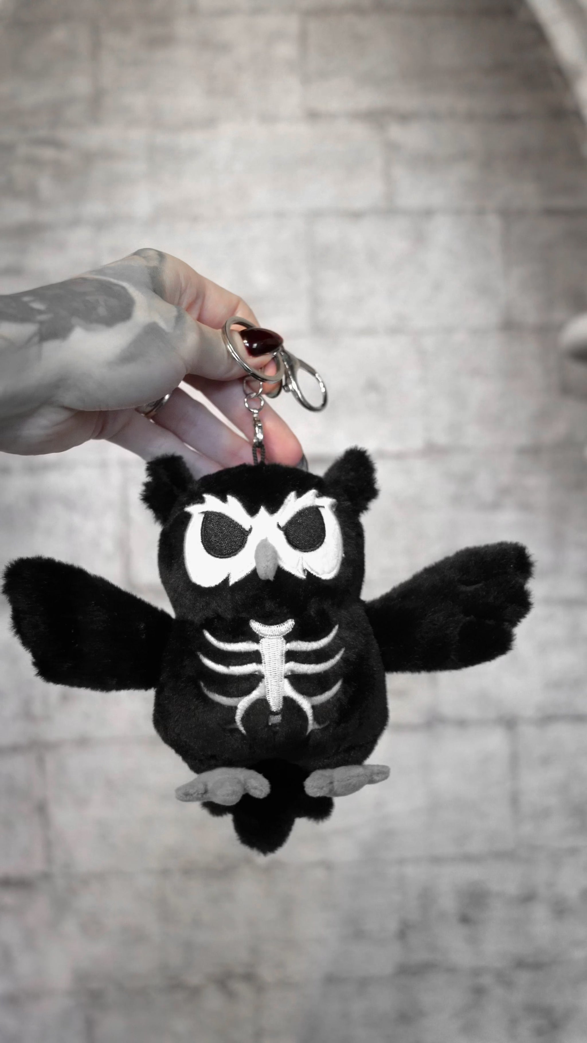video of a skeleton owl keychain