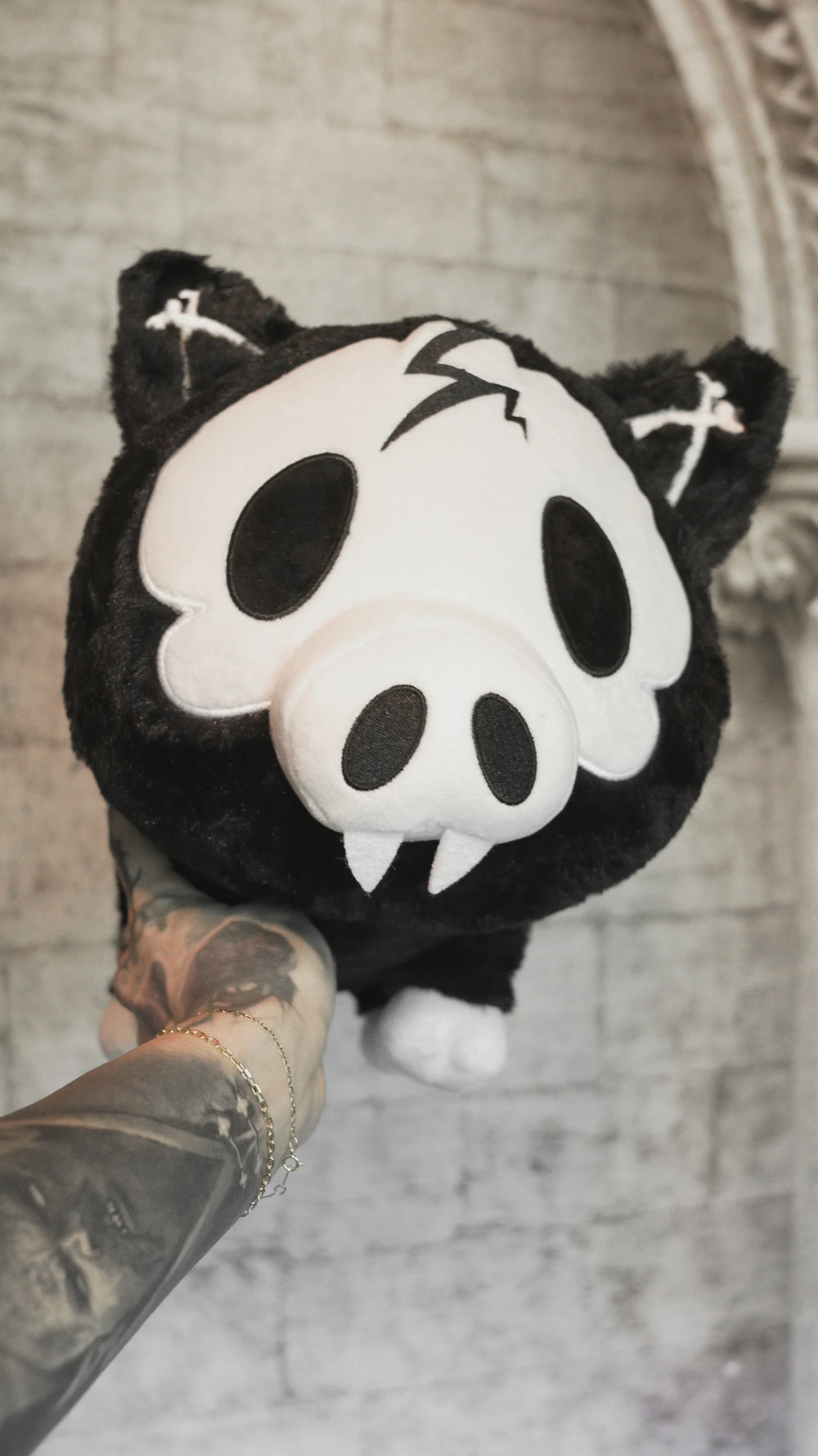 video of a stuffed animal skeleton plushie with spiral tail