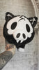 video of a stuffed animal skeleton plushie with spiral tail