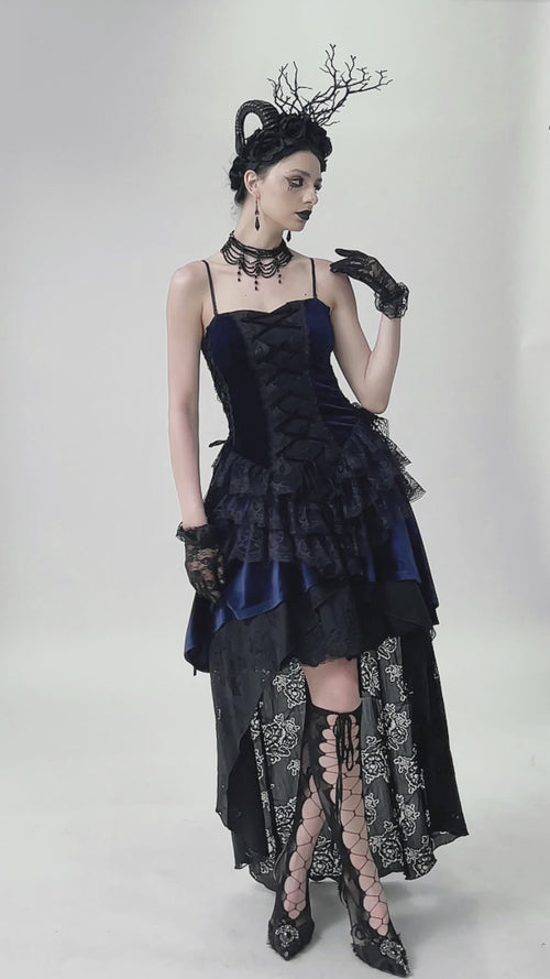 video of a gothic woman wearing a ruffled long maxi dress with back train