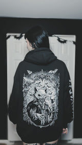 gothic woman wearing a vampire bat hoodie jacket