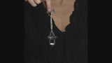 video of a gothic woman wearing a gothic bat pewter necklace 