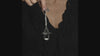 video of a gothic woman wearing a gothic bat pewter necklace 