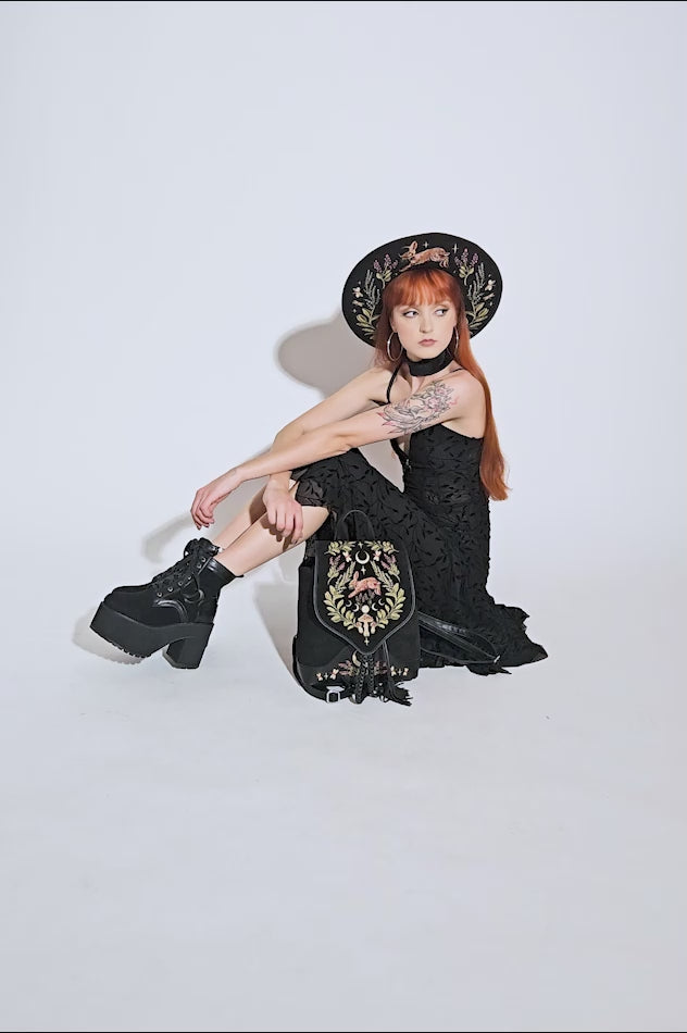 video of witchy woman wearing a whimsigoth backpack