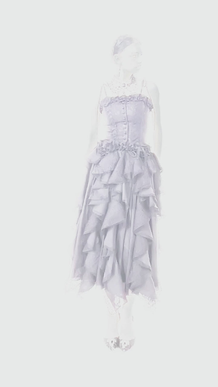 video of a gothic woman wearing a lolita black tank top with adjustable bow shoulder straps 