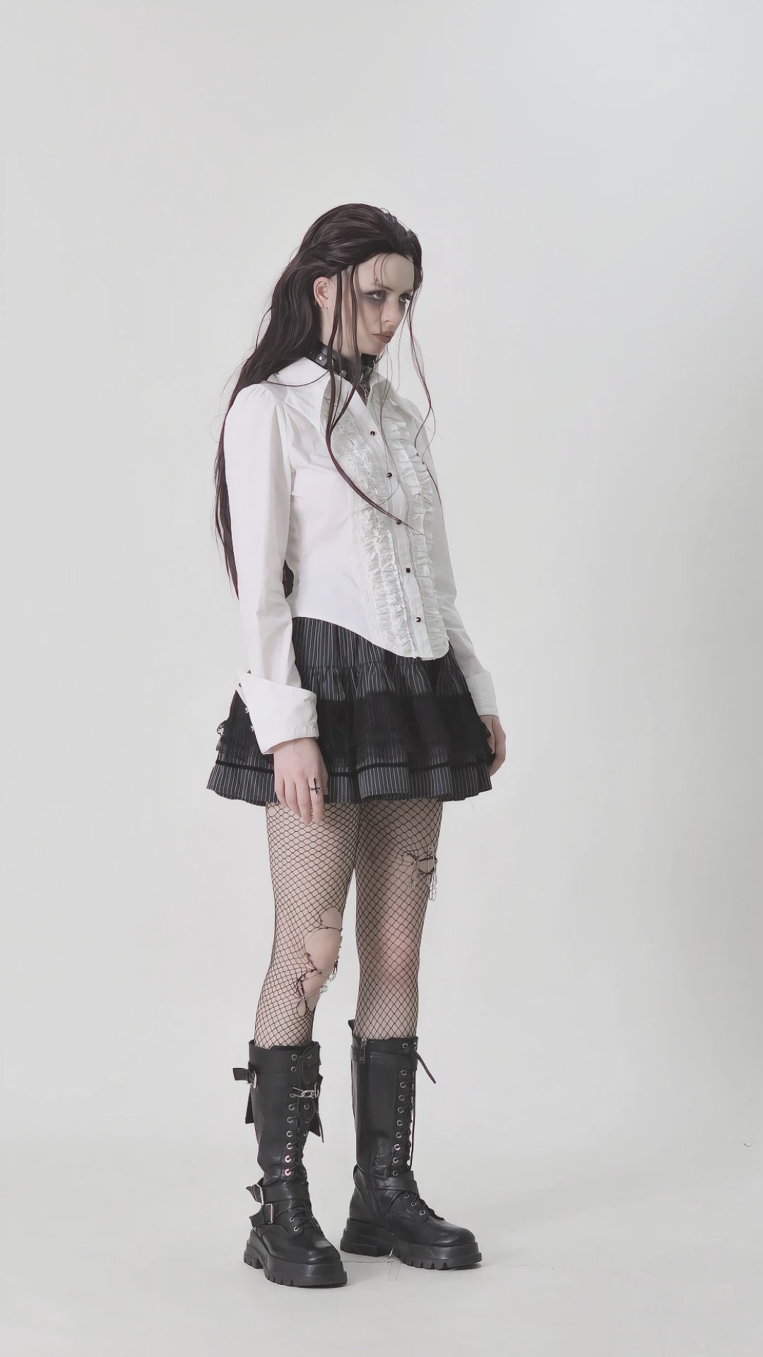 video of a gothic woman wearing a white puff sleeve button-up pirate shirt