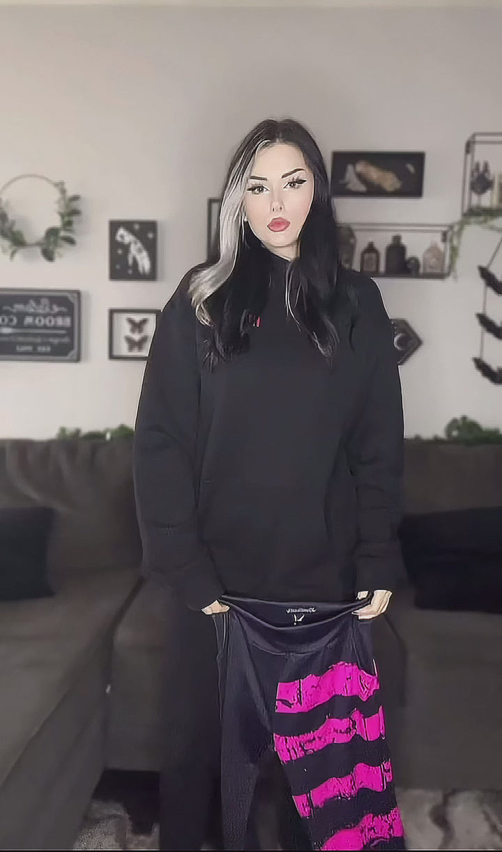 video of woman wearing high-waisted pastel goth leggings with pockets 