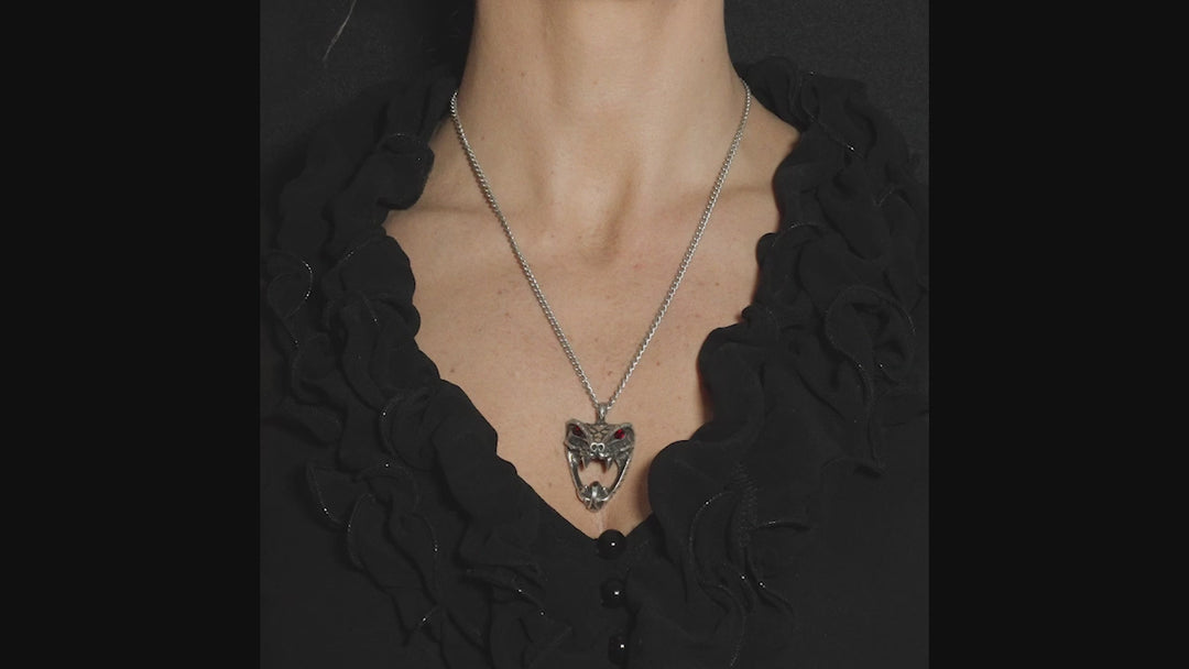 video of a gothic woman wearing a spooky gothic snake necklace with red crystals 