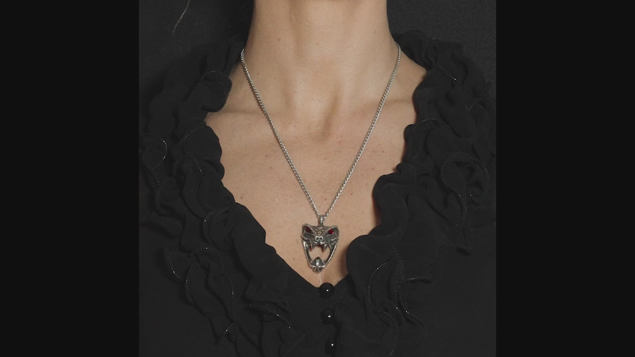 video of a gothic woman wearing a spooky gothic snake necklace with red crystals 