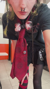 video of emo girl wearing a emo skeleton cat stuffed animal bag