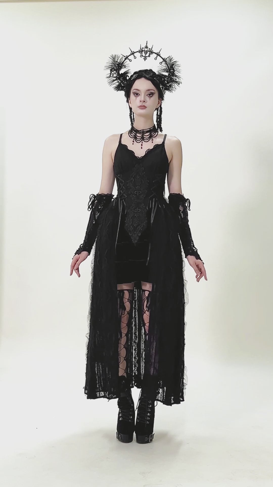 video of a gothic woman wearing a long black corset princess dress with a long black lace skirt