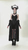 video of a gothic woman wearing a long black corset princess dress with a long black lace skirt