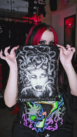 video of scene woman with pink hair wearing an oversized emo sweater and striped socks