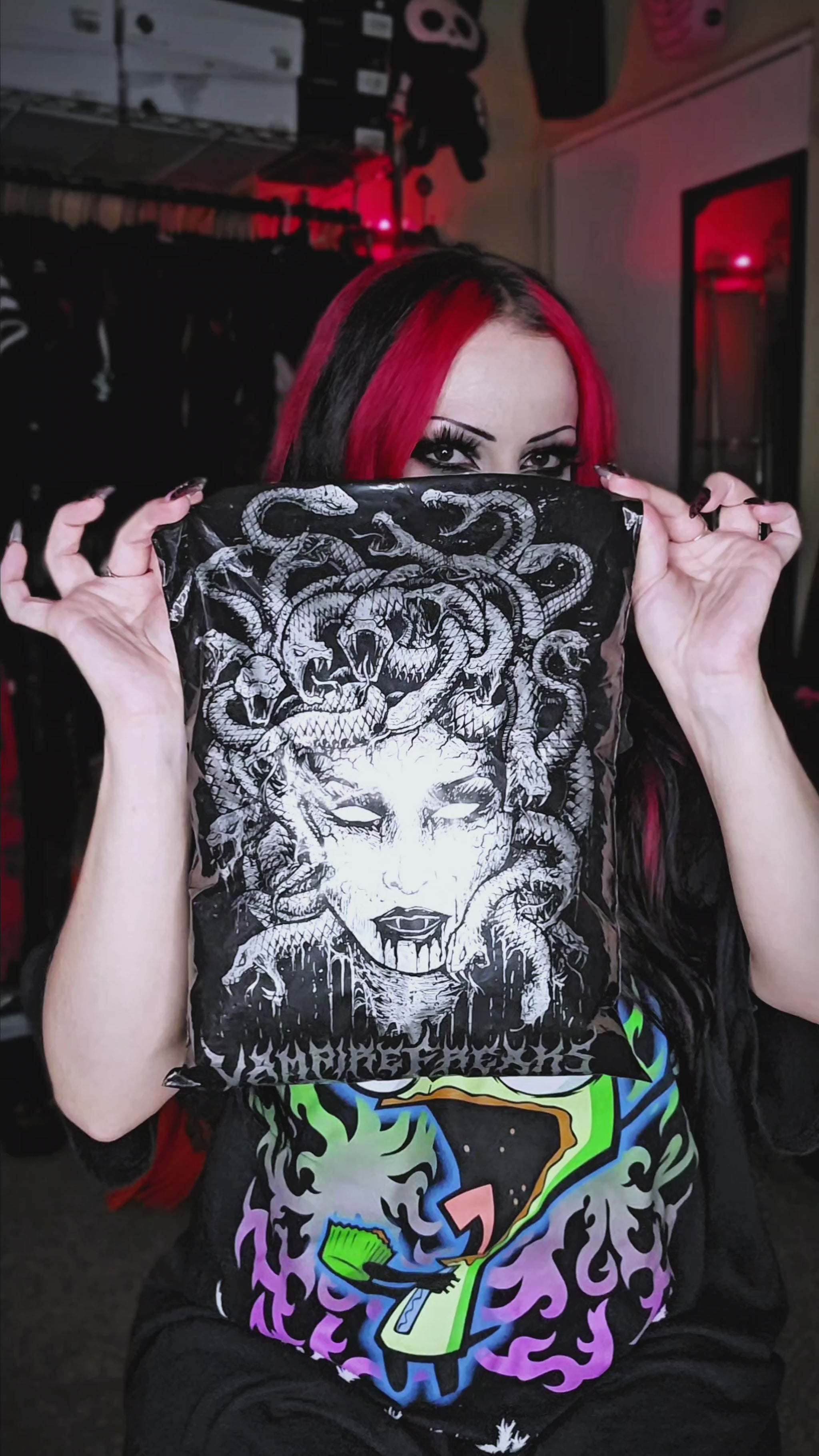 video of scene woman with pink hair wearing an oversized emo sweater and striped socks